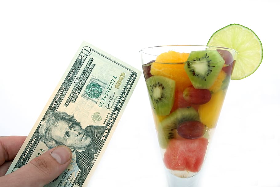 person holding 20 U.S. dollar beside cup with sliced fruits, alcohol, HD wallpaper