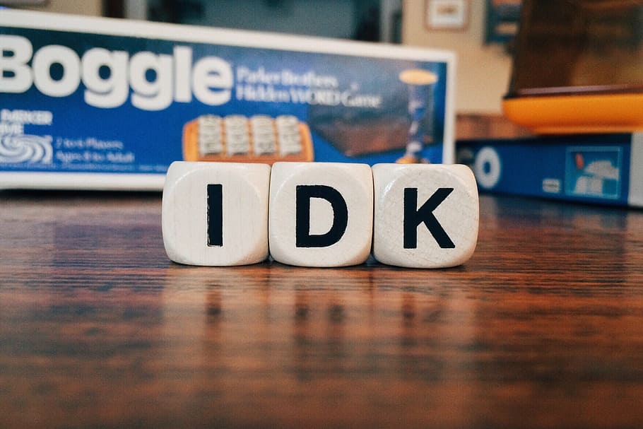 closeup photography of IDK boggle letter dices on table, i don't know