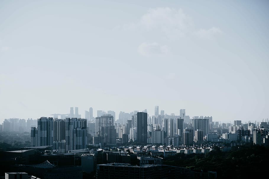 panoramic photo of cityscape, photo of building under white clouds at daytime HD wallpaper