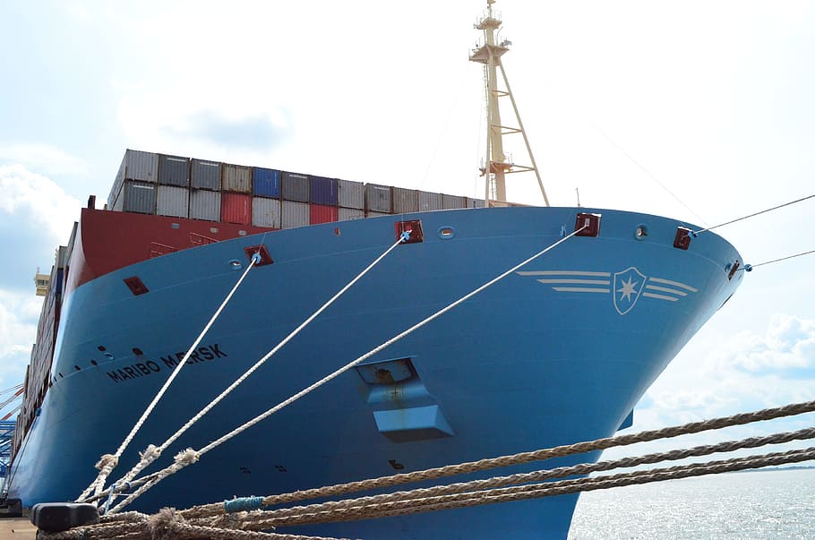 blue shipping container ship near docking area during daytime HD wallpaper