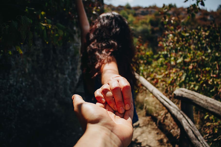 person holding woman in black suit during day time, nature, outdoors HD wallpaper