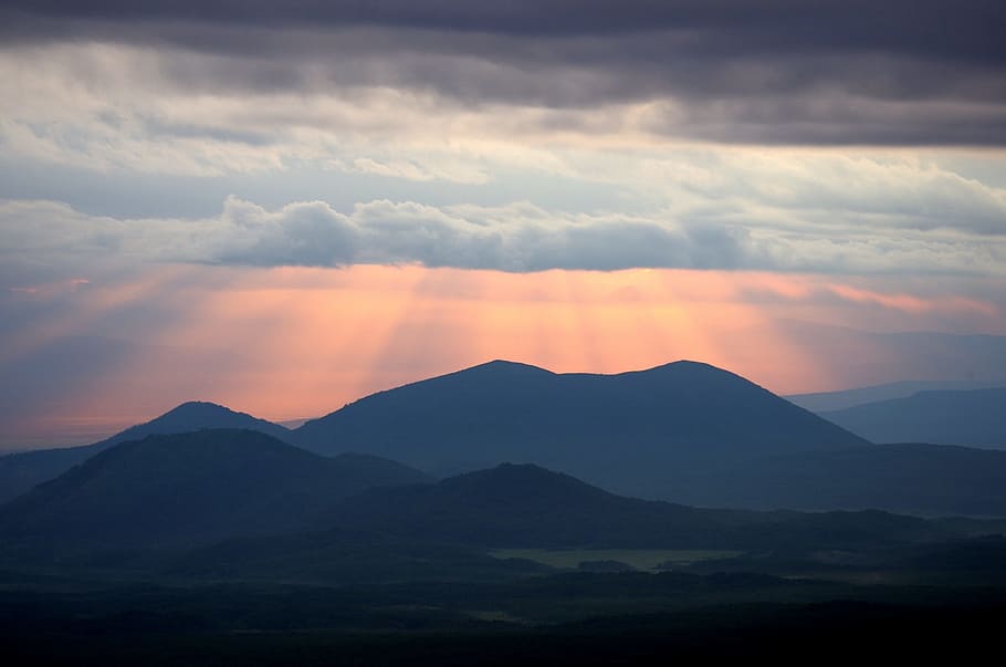 silhouette of mountain with ray of lights, sunset, clouds, evening HD wallpaper