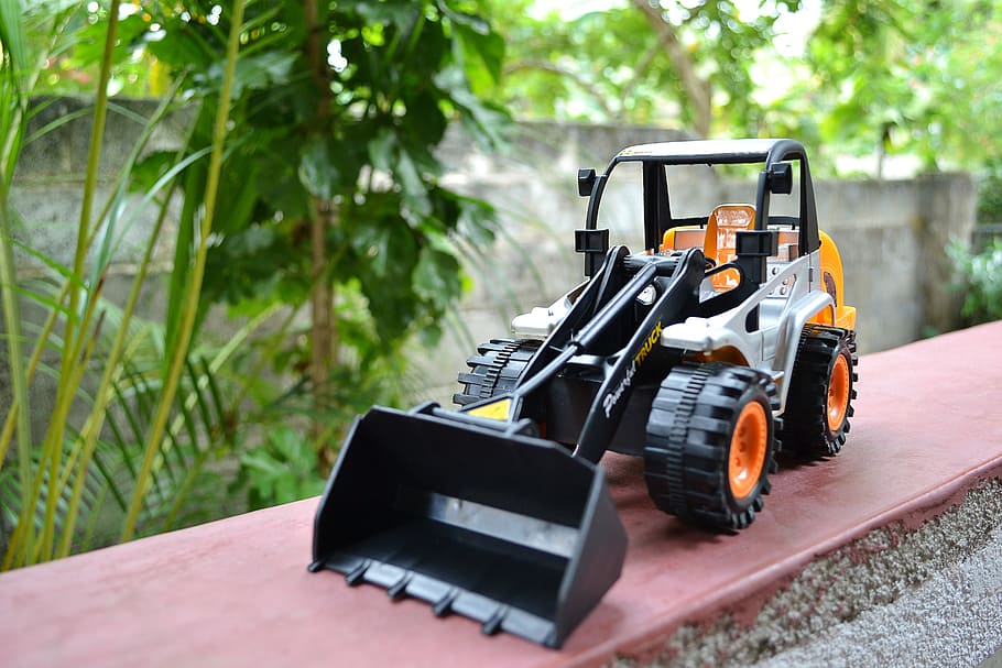 shallow focus photography of payloader toy, plastic, dozer HD wallpaper