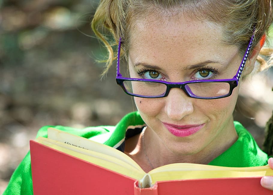 woman holding red hardbound book, reading, books, learning HD wallpaper