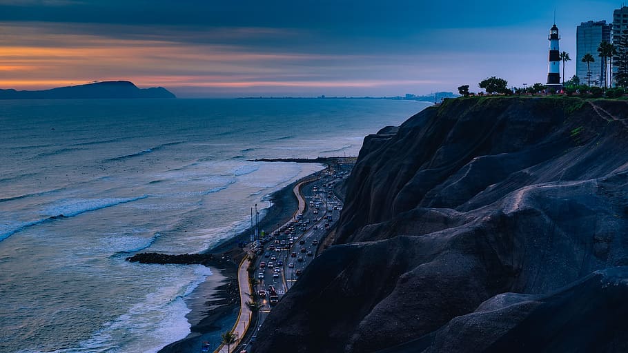 vehicles on road beside cliff near body of water, peru, lighthouse HD wallpaper