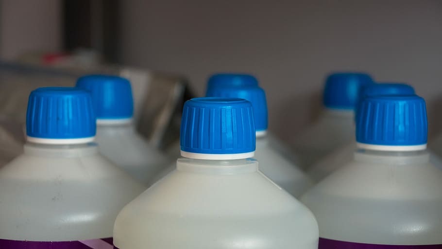 white-and-blue plastic bottles near wall, Cap, Liquid, Container