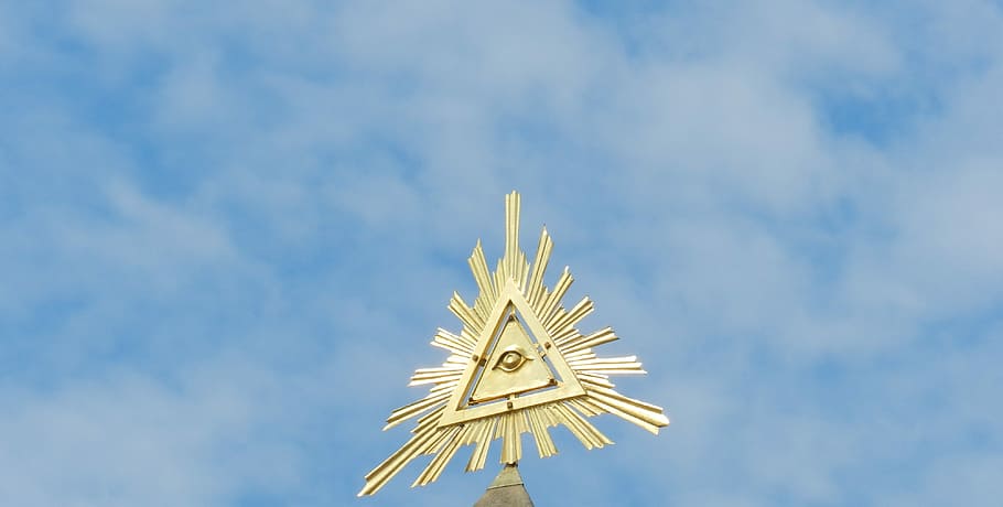 close-up photo of gold all seeing eye decor, Triangle, Trinity