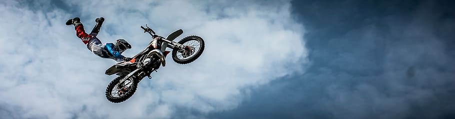sports photography of motocross racer holding motocross dirt bike seat while suspended on air, HD wallpaper