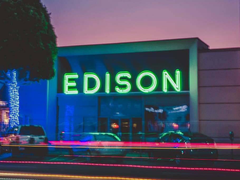 three vehicles parked in front of Edison building, time lapse photo of Edison building HD wallpaper