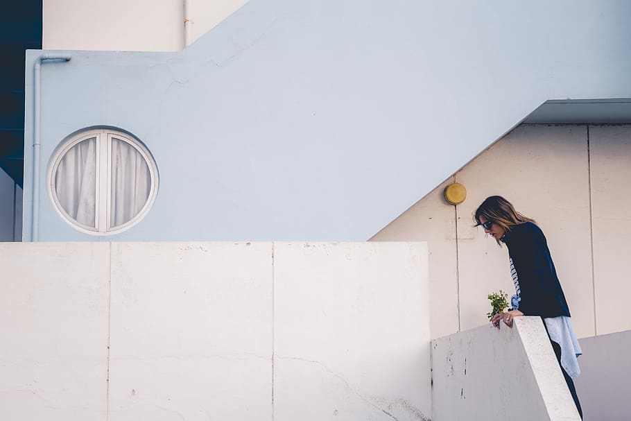 woman looking down, woman in black cardigan looking down near gray concrete stairs HD wallpaper