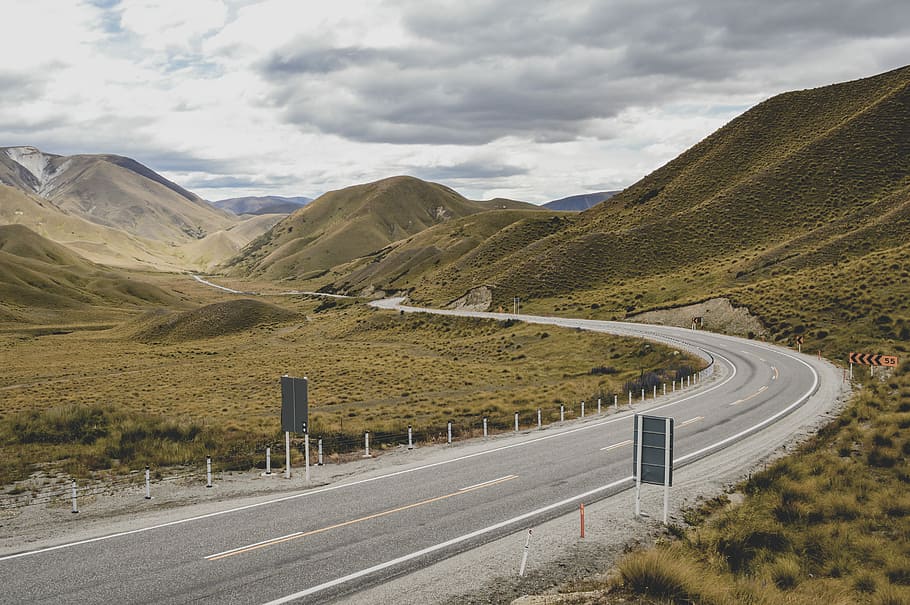 asphalt road between mountain, road beside mountain, grass, hill HD wallpaper