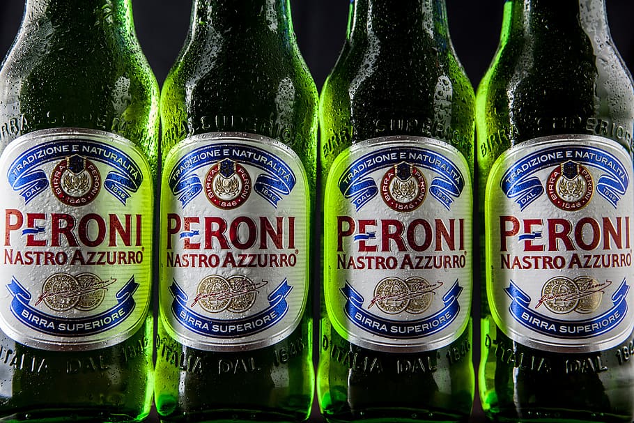 Close-up shot of green Peroni lager beer bottles, food/Drink