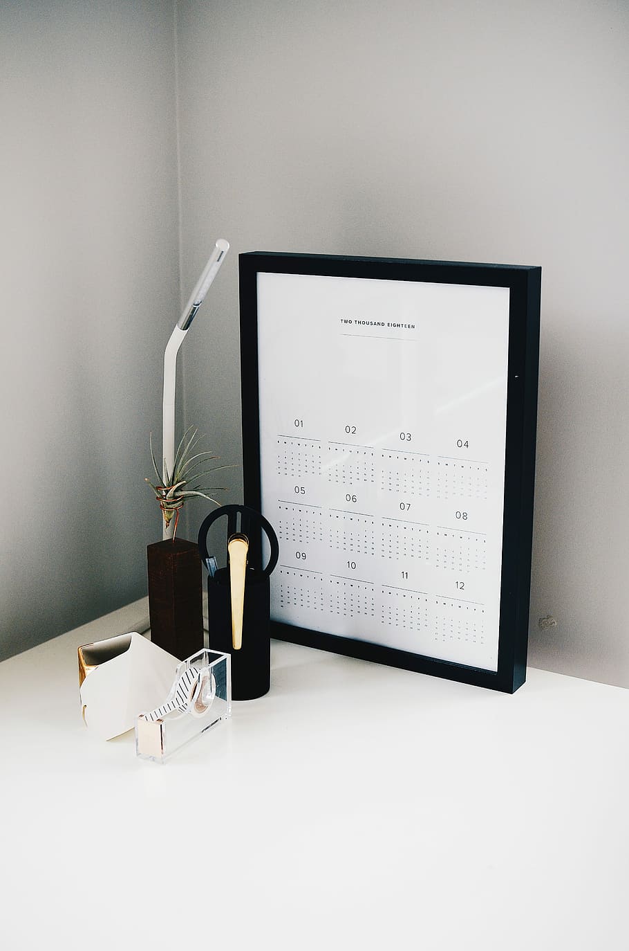 calendar with black frame on table, white calendar on table beside lamp HD wallpaper