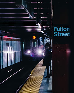 person standing on train station, person standing beside Fulton Street train station HD wallpaper
