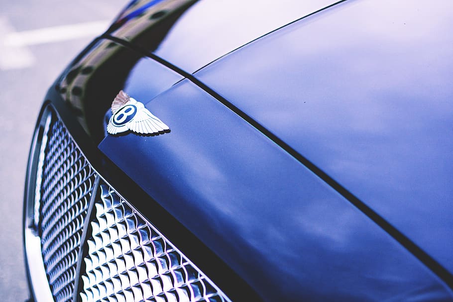 Closeup shot of Bentley luxury car, various, business, money