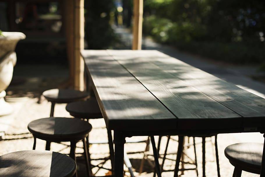 Restaurant Patio Furniture, grey wooden table, seats, irregular