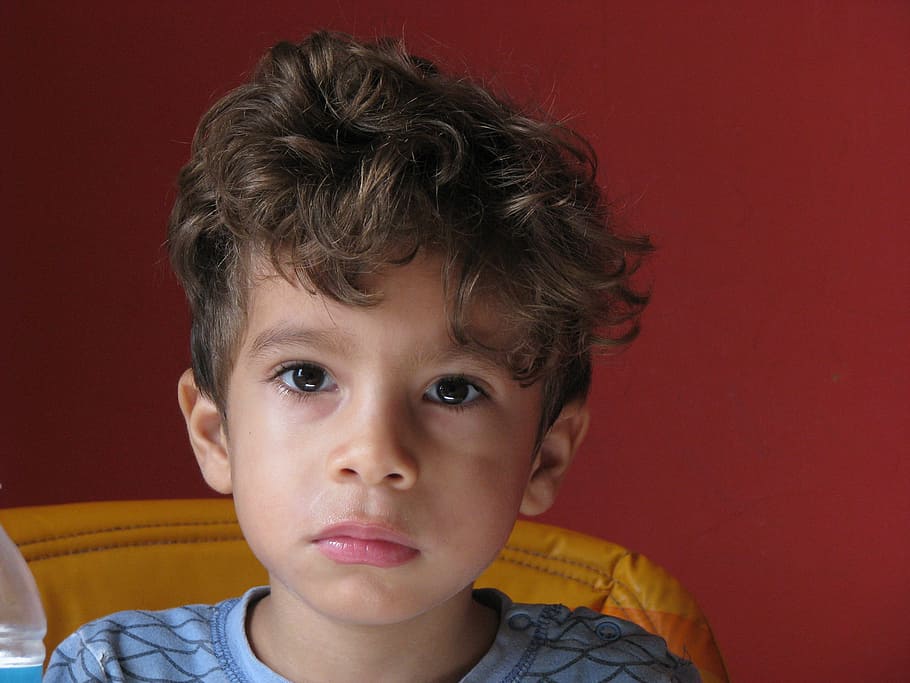 boy sitting on yellow sofa chair, child, look, eyes, guy, young HD wallpaper