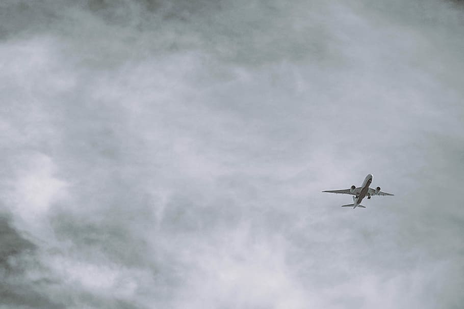 grayscale photo of airliner, airplane on sky under cloudy skies HD wallpaper