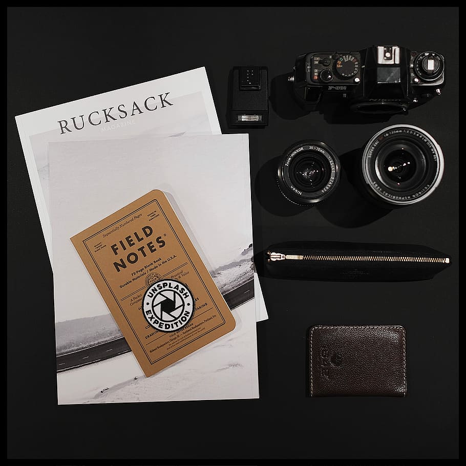 Rucksack Magazine - Volume One, black SLR camera with case and brown leather bifold wallet HD wallpaper