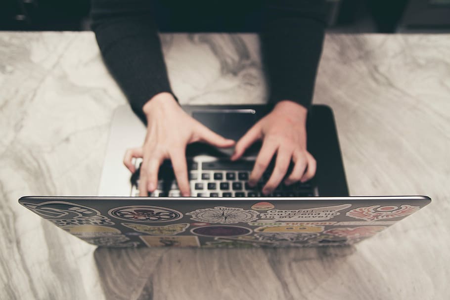 person typing on MacBook, person typing on black laptop computer HD wallpaper