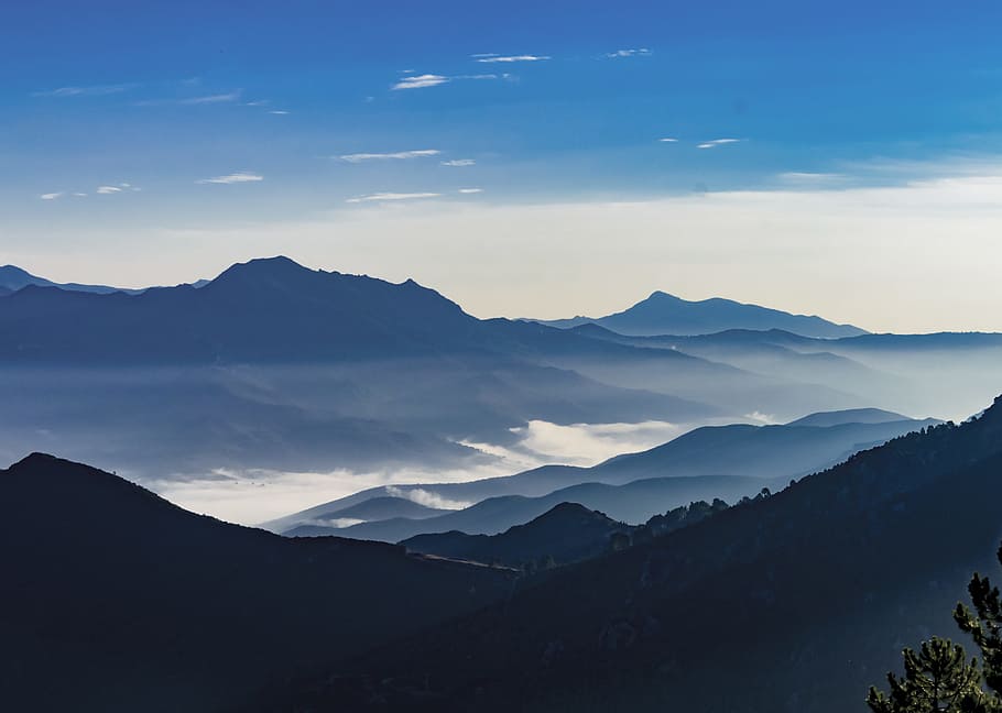photography of sky during daytime, aerial photo of mountains with green trees surrounded by clouds under blue sky at daytime HD wallpaper