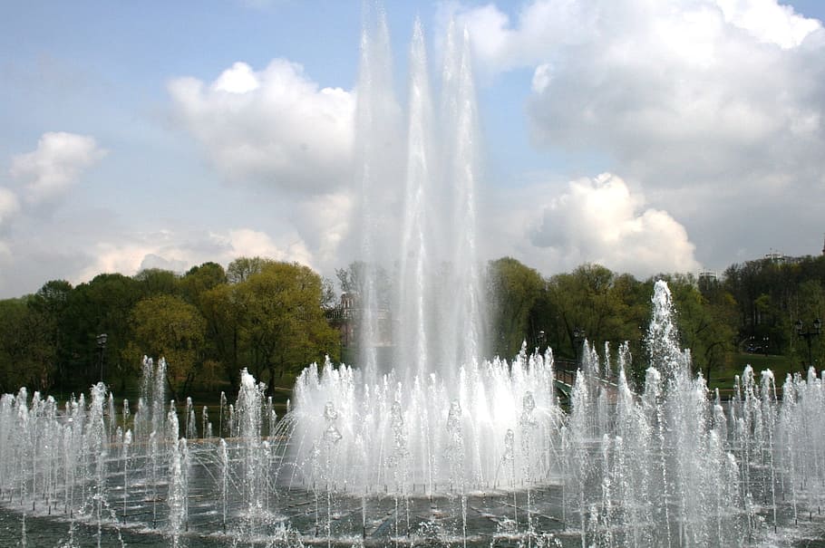 fountain, water, spout, spray, white, trees, clouds and sky HD wallpaper