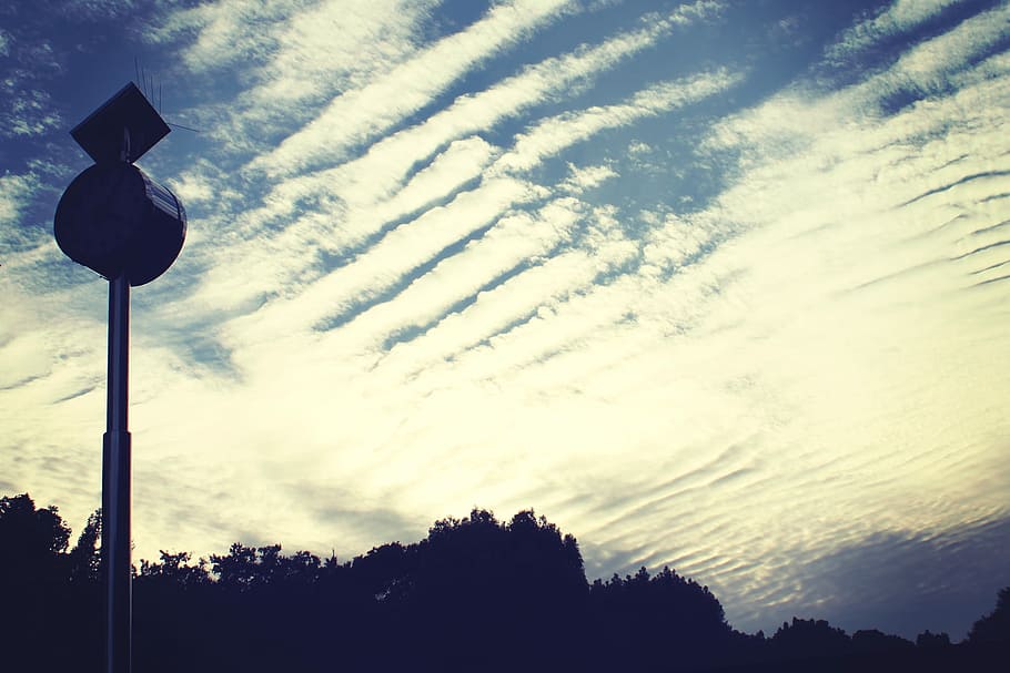 silhouette photography of black utility post and cirrus clouds during daytime HD wallpaper