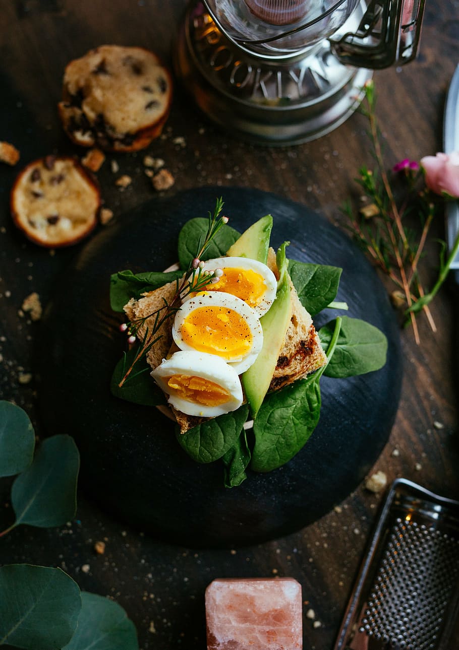 slice boiled eggs on sandwich with spinach, loaf, bread, green