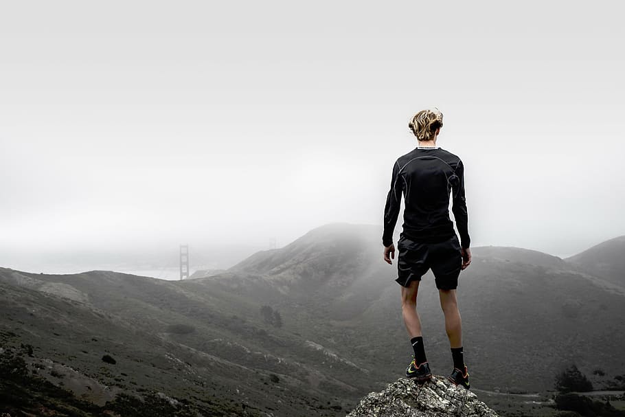man standing on peak of mountain under cloudy sky, nature, mountains HD wallpaper
