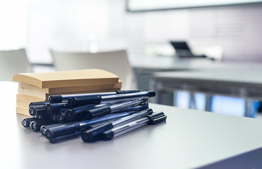 black ballpoint pen lot on white table, workshop, pens, post-it note HD wallpaper