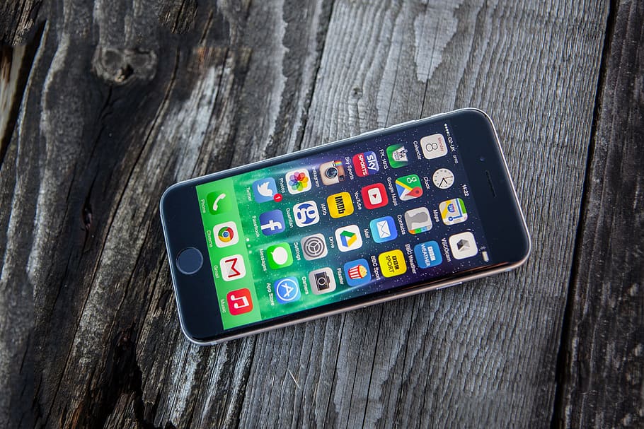 High resolution shot of the iPhone 6 mobile smartphone on a wood textured background, HD wallpaper