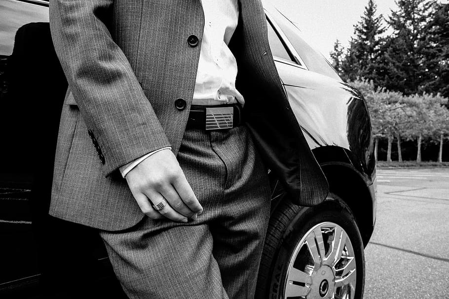 person in pinstripe suit jacket and dress pants standing beside car, HD wallpaper