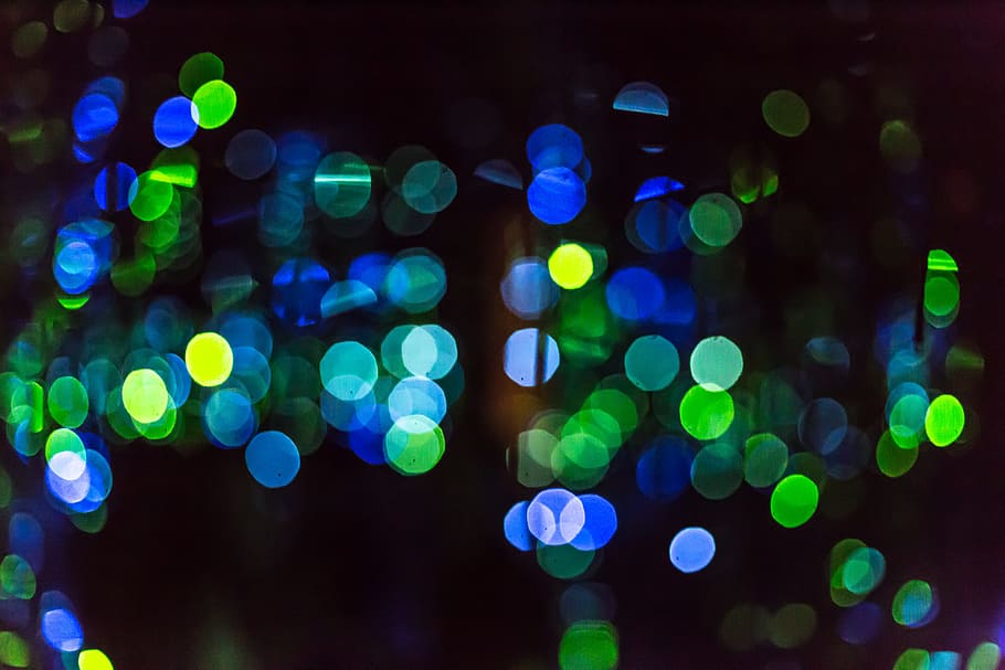 Close up of multi colored speckled glowing dots bokeh artwork at Phoenix Art Museum, blue and green bokeh lights