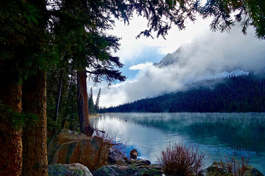 gray mountain with sky mirrored into water, lake, wilderness HD wallpaper