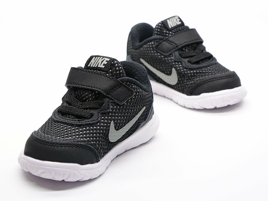 pair of toddler's black-and-white Nike sneaker on white surface, HD wallpaper