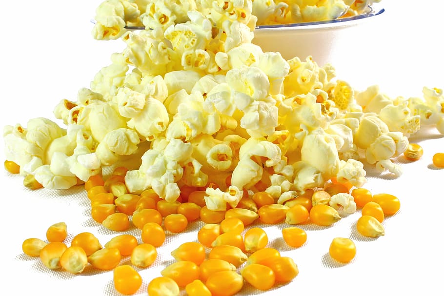 popcorn on white surface, popcorn in butter, food, food and drink