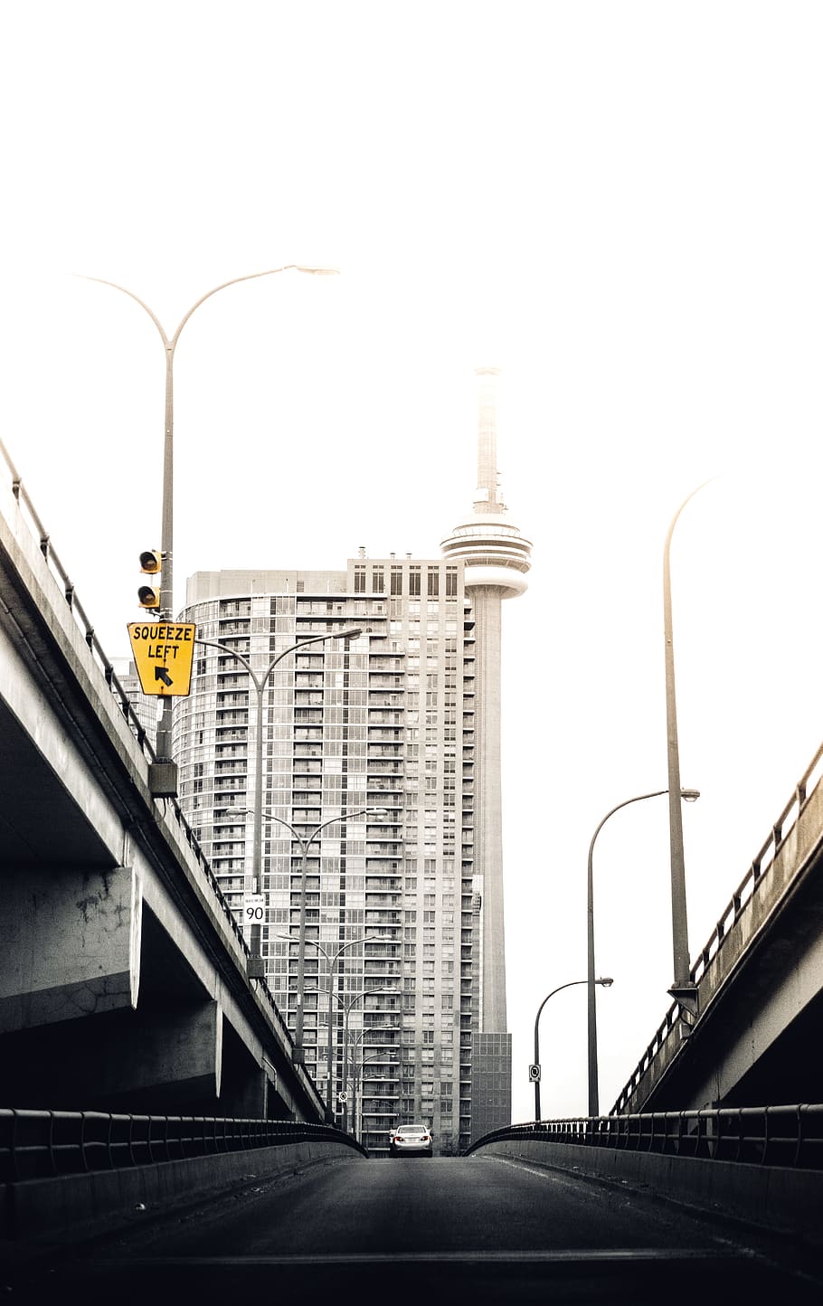 C.N Tower, gray car in middle of street road under cloudy sky HD wallpaper