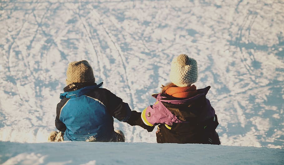 two person sitting on snow during daytime, winter, outdoors, child HD wallpaper