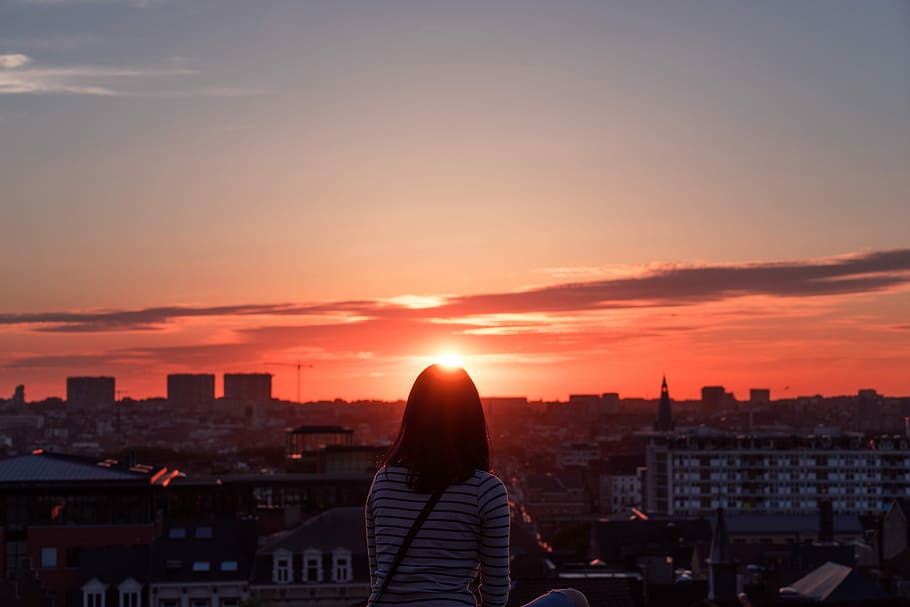 woman standing in front of sunset, woman in white and black striped standing in front of sunset HD wallpaper