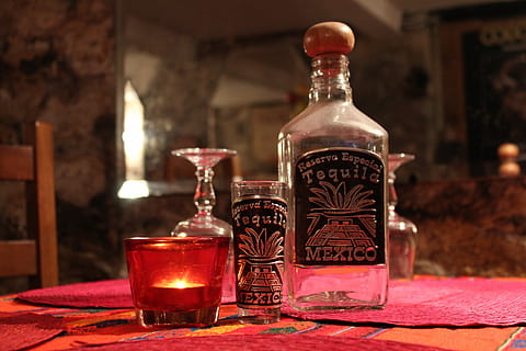 closeup photo of bottle with shot glass, Tequila, tequila bottle HD wallpaper