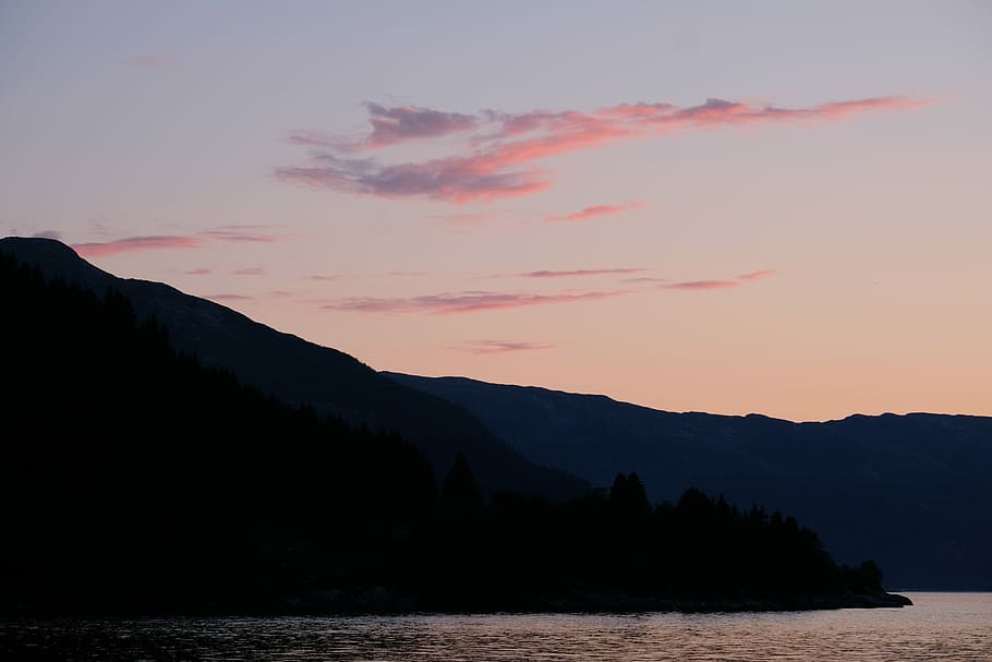 Pink Sky and Clouds, silhouette of mountain beside body of water HD wallpaper
