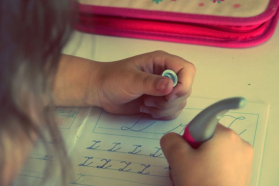 person writing letters using pen on writing book, child, kid HD wallpaper
