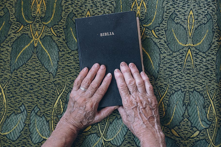 person holding Bible book, design, elderly, fingers, hands HD wallpaper