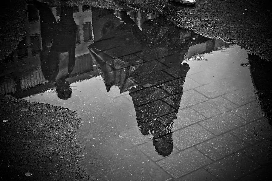 two women's walking next to grey building during daytime, rain HD wallpaper