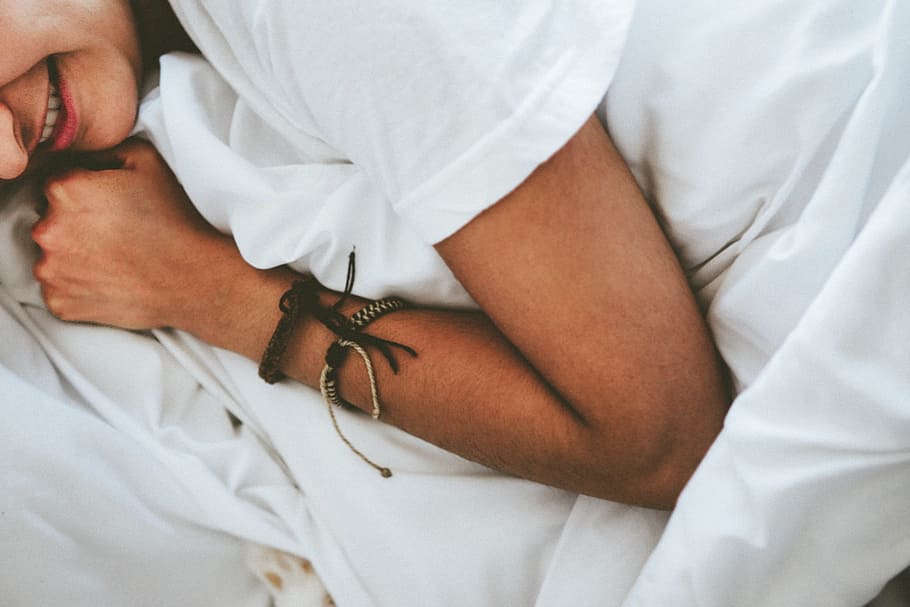 person lying on white textile, people, bed, sleeping, sheets HD wallpaper