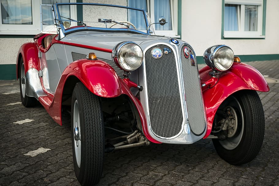 classic gray and red vehicle parked near white building at daytime HD wallpaper