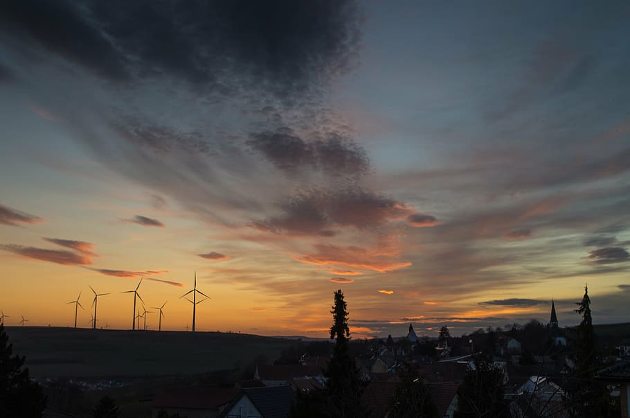 silhouette of windmills during golden hour, turbines, trees HD wallpaper