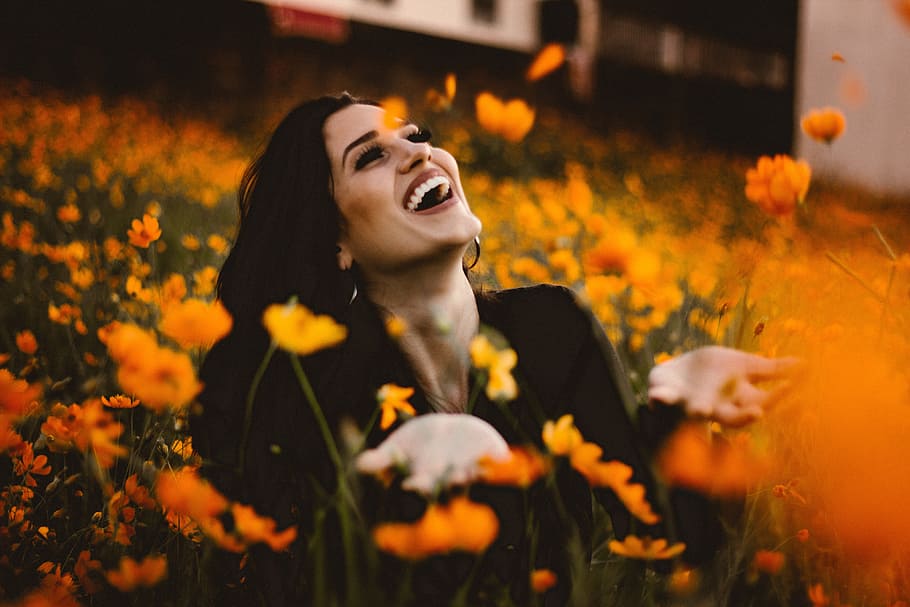 Laughing woman in flowers with smile, people, happy, nature, women