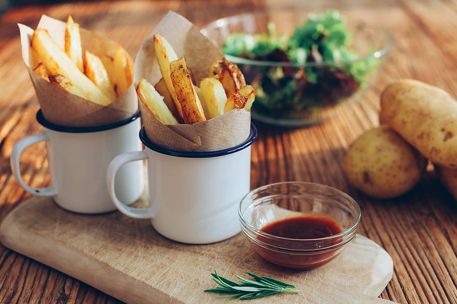 Chips, two mugs filled with French fries near bowl with sauce HD wallpaper