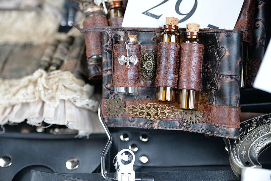 selective focus photography of vial on leather belt, steampunk HD wallpaper